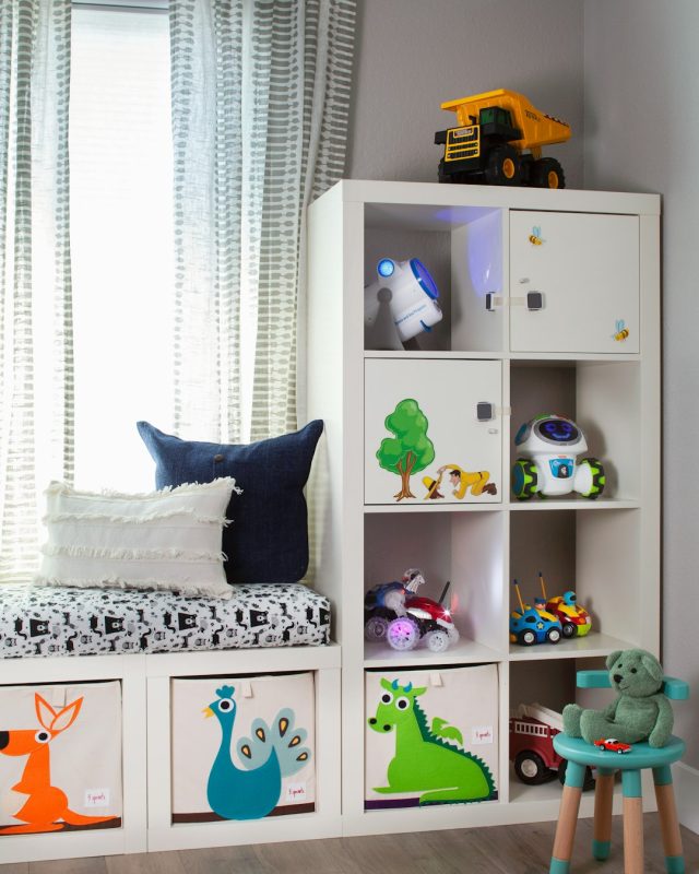 a child's room with a bookcase and toys